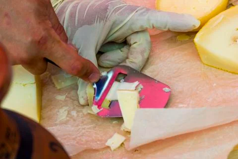 Slicing cheese for tasting Stock Photos