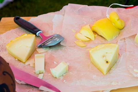 Slicing cheese for tasting Stock Photos