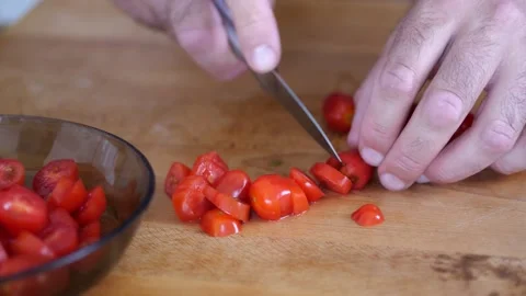 Slicing cherry tomatoes for pizza or salad. Close-up and macro views of cut.. Stock Footage 280035890