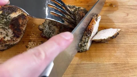 Slicing Chicken Slow Motion Stock Footage 318700104
