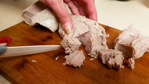 Slicing cooked, cooked pork meat knife. Cooking, preparing meat, cutting meat Stock Footage 313725941