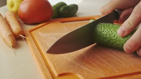 Slicing a cucumber. Stock Footage 134555735