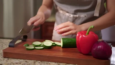 Slicing a cucumber Stock Footage 336010328