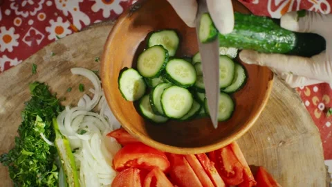 Slicing cucumber for a salad Stock Footage 138127821