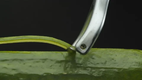 Slicing a cucumber with a special vegetable knife Stock Footage 167235980