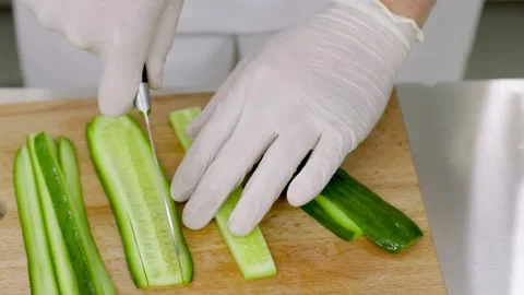 Slicing cucumber into thin strips Stock Footage 150252780