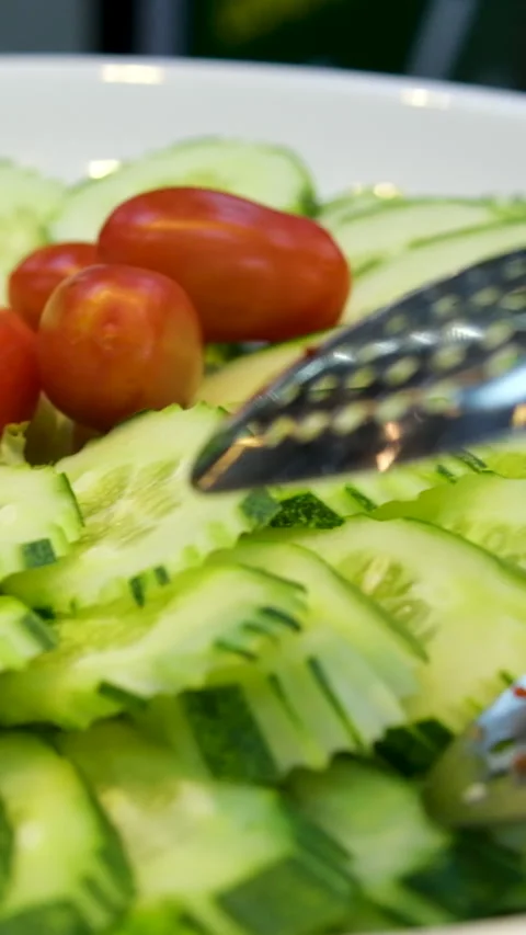 Slicing cucumbers fresh cucumbers. chopped cucumber top view Stock Footage 276782253