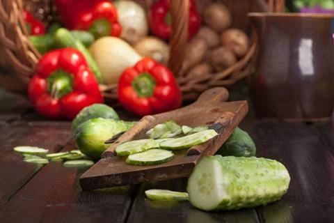 Slicing cucumbers Stock Photos