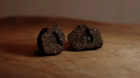 Slicing delicate truffles with a truffle knife for gourmet dishes Stock Footage 321418865