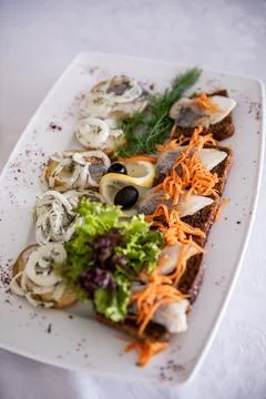 Slicing different types of fish. Cutting red and white fish. Festive table Foto stock