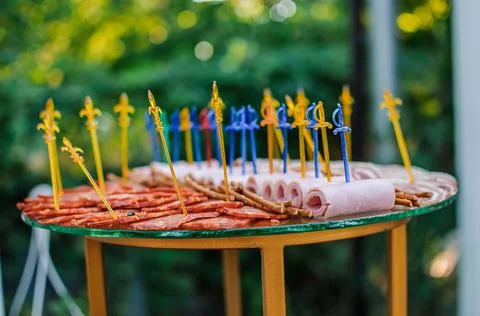 Slicing different types of meat. Wedding buffet Stock Photos
