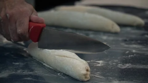 Slicing Dough in the Kitchen Stock Footage 317472624