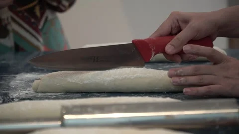 Slicing Dough in the Kitchen Stock Footage 317472631