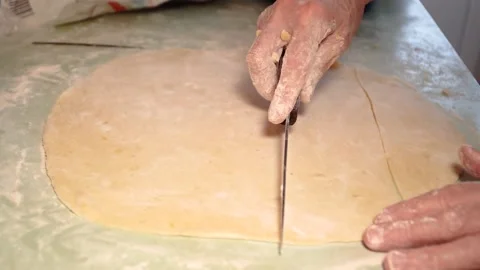 Slicing the dough, preparing the dough, shaping the dough Stock Footage 168901594