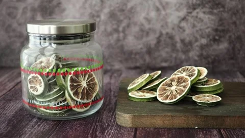 Slicing dried lime for drinks and garnishes Stock Footage 337284868