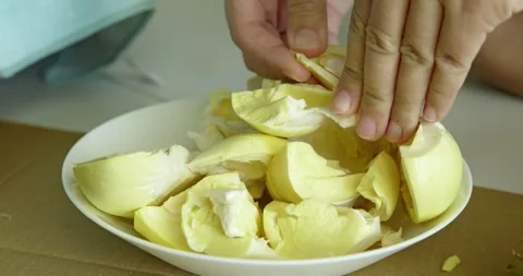 Slicing durian fruit delightfully home kitchen food preparation indoor Stock Footage 337451186