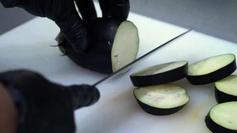Slicing Eggplant in a Professional Kitchen Stock Footage 319207304