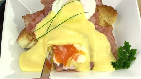 Slicing Eggs Benedict With A Knife Stock Footage 63139631