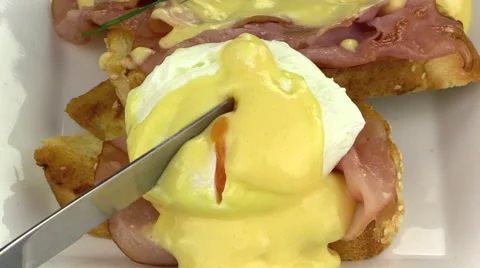 Slicing Eggs Benedict With A Knife Stock Footage 63142393