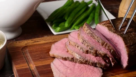 Slicing eye of round roast beef  Stock Footage 270190129