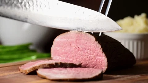 Slicing eye of round roast beef  Stock Footage 270190511
