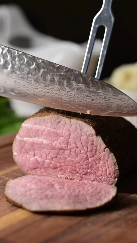 Slicing eye of round roast beef  Stock Footage 270191122
