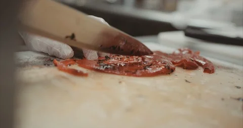 Slicing up fire broiled red pepper Stock-Footage 105310709