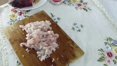 Slicing fish fillets into small pieces. Stock Footage 77901069