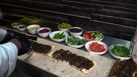 Slicing Flatbread in Kitchen Stock Footage 319950667