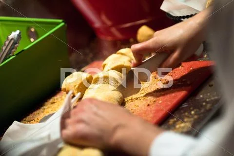 Slicing french bread Stock Photos