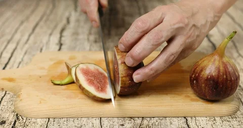 Slicing fresh figs to make compote Stock Footage 114646635