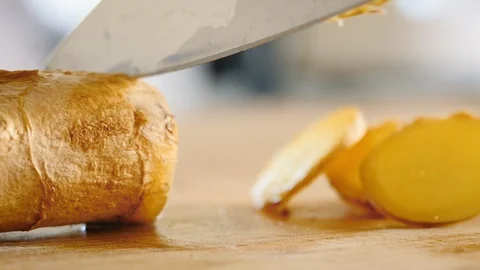 Slicing Fresh Ginger Root Stock Footage 125116778