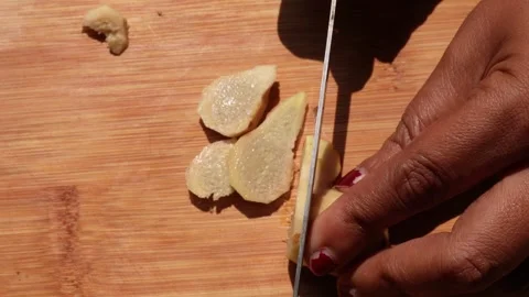 Slicing fresh ginger root Stock-Footage 332575876