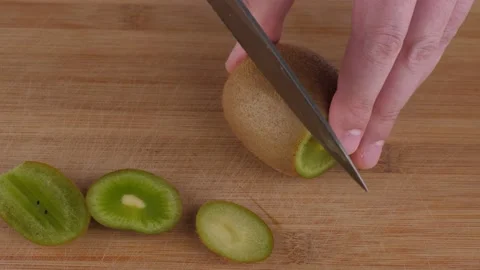 Slicing Fresh Kiwi Video stock 133629041