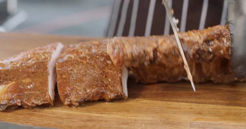 Slicing fresh meat, preparing a steak. Cooking, preparation. Stock Footage 149114502
