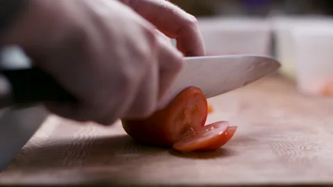 Slicing a fresh tomato. Stock Footage 134503859