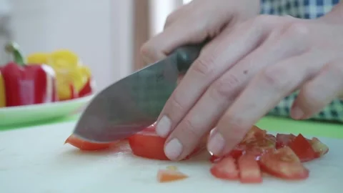 Slicing Fresh Vegetables in a Kitchen Stock Footage 313830036
