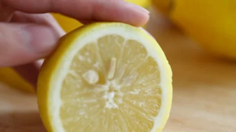 Slicing a fresh yellow lemon Stock Footage 7769193