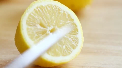 Slicing a fresh yellow lemon Stock-Footage 7769248