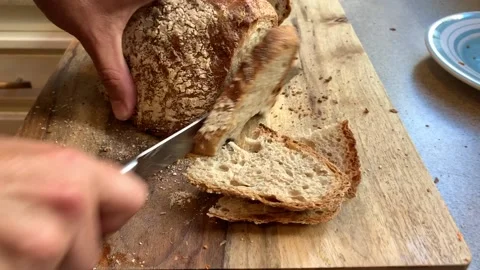 Slicing Freshly Baked Bread, Baked at Home Stock Footage 134214959