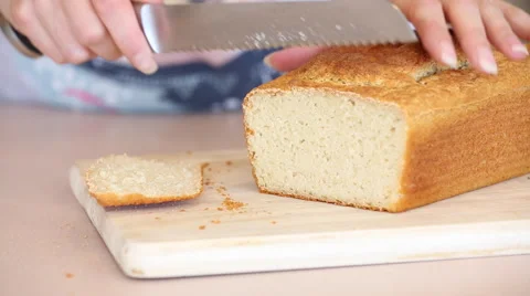 Slicing Freshly Baked Bread on a Cutting Board Stock Footage 51025085
