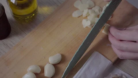 Slicing Garlic for Flavor Stock Footage 290103405
