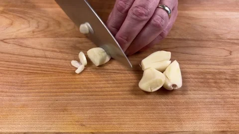Slicing Garlic Stock Footage 318700405