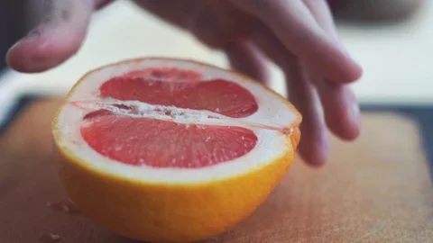 Slicing grapefruit in slow motion Stock Footage 86682796