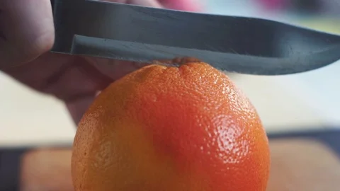 Slicing grapefruit in slow motion Stock Footage 86682803