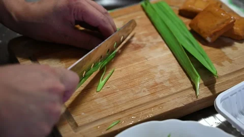 Slicing Green Garlic Sprouts for a Cold Dish Video stock 346487225