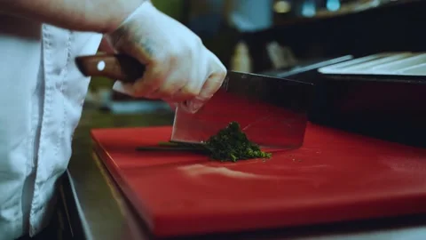 Slicing greens by the cook close-up Stock Footage 201757053