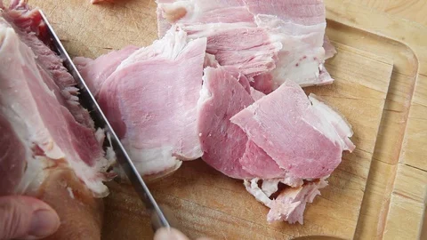 Slicing a ham Stock Footage 108796173