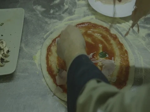 Slicing ham with hands on pizza  12 Stock Footage 80674515