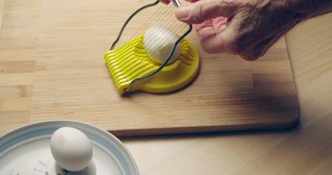 Slicing hard boiled egg. Stock Footage 102803807
